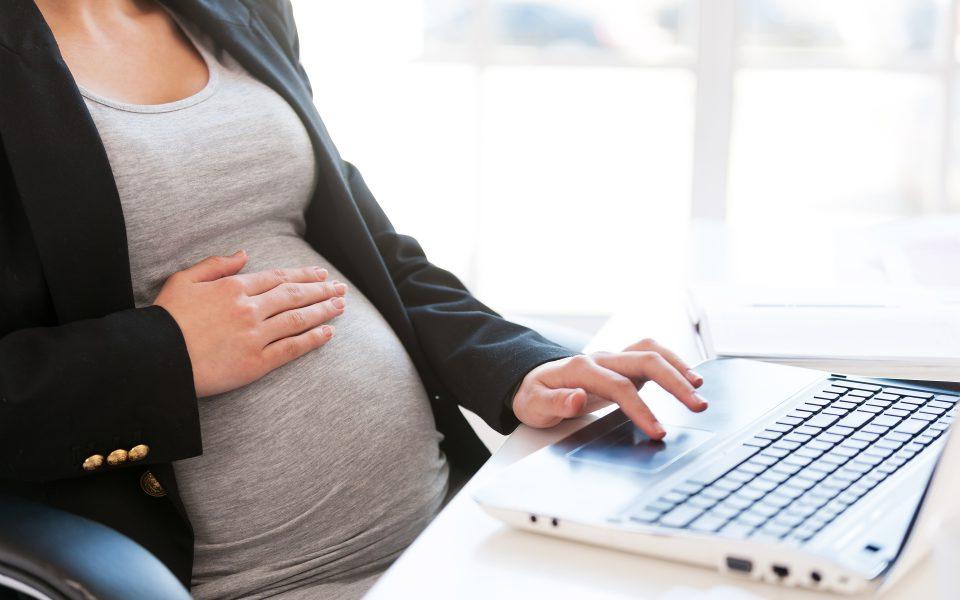 Pregnant woman using a laptop computer